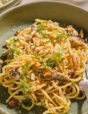 Sardine pasta in a bowl with a fork.